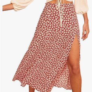 Red floral midi skirt with elastic waistband and side slit.